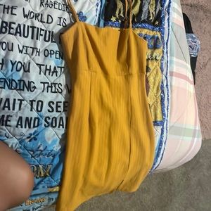 A womens dress orange dress with white strips